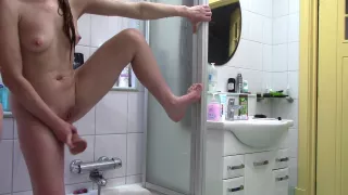 Wife Fucks Herself With A Big Dildo In Front Of The Shower Mirror And Masturbates