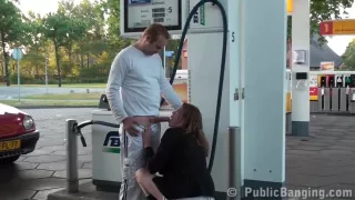 Horny babe is getting fucked on a gas station, in the middle of the day