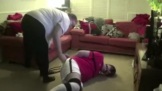 Male Strictly bound gagged and hogtied in football kit