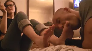 Cute brunette with glasses gets her socks and feet licked out by a bald dude