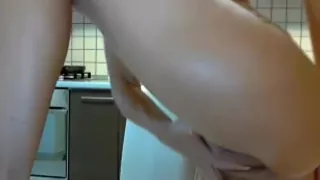 MILF Fingers Pussy In The Kitchen