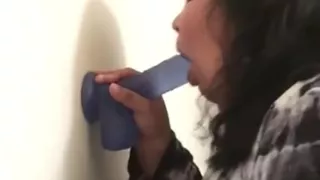 Latina sucks on dildo