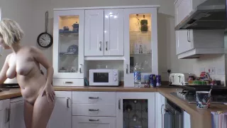 Hot blonde with big tits and sexy ass making coffee naked