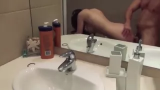 Tattooed brunette banged over bathroom sink