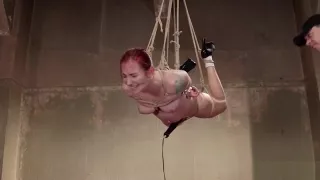 Redhead sub hogtied and suspended