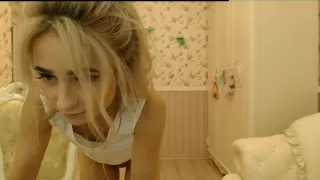 Blonde woman in red pants teases