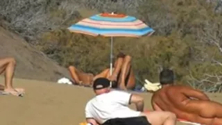 Daring masturbation on a crowdy beach