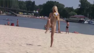 Two Teens At A Nudist Beach Playing Beach Ball