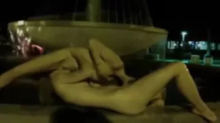 Naked night-time fountain play