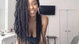 Busty ebony sucks a fake black cock