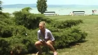 blonde peeing on the beach