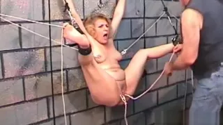 Bare woman screams with man roughly playing with her vag