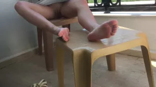 Feet And Pussy Showing. She Plays With Feet And Pussy On A Public Balcony