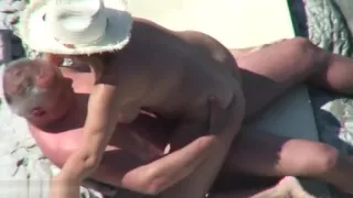 Mature nudist couple caught fucking at the beach
