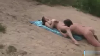 Busty hot milf gets her pussy licked on public beach