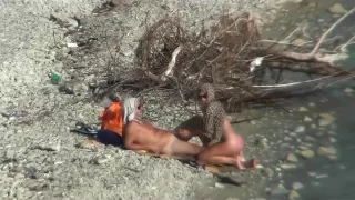 Couple fucking on a public beach, while walking past people