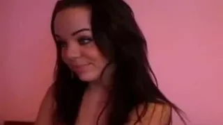 Sexy brunette strips and masturbates on webcam