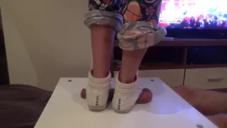 Girl in sneakers trample on cock and balls. Ends bootjob and cumshot