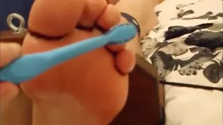 tickle toy feet on the table tickling