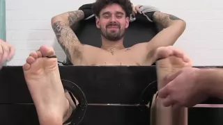 Tattooed amateur endures feet ticking from a mature master