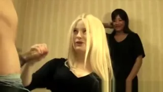 Young slutty blonde giving handjob