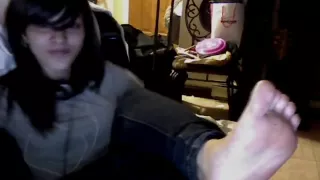 feet to the camera and singing (youtube original)