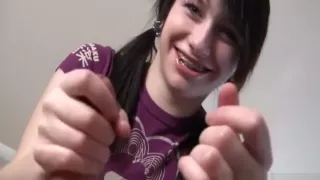 Petite girl with pigtails gives her first hand job