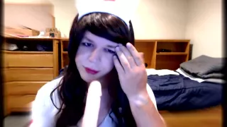 Cute Crossdresser Nurse Blows Dildo