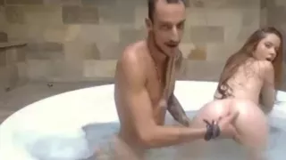 Couple having fun in a bathtub