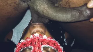 Masked lady sucks black balls