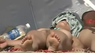 Hotty showing butt and love tunnel on nude beach