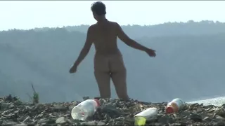 Mature woman with a big ass on a nudist beach