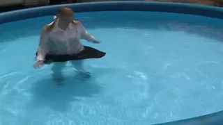 Schoolgirl swimming in pool