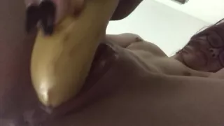 Teens tight pussy takes a big banana and dildo