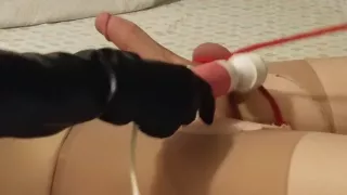 Mistress ties up slaves balls and shocks his dick while jerking