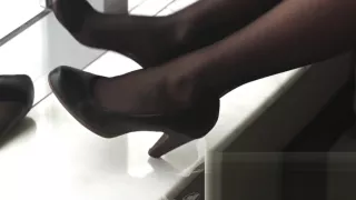 #64 black stockings on window seat