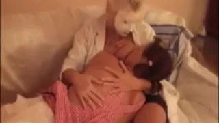 Nurse has her tits sucked by a lesbian