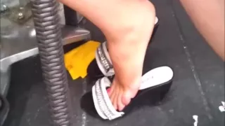 Candid Russian Woman Shoeplays Mules under the chair