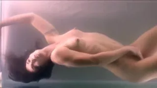 Fit woman masturbates underwater