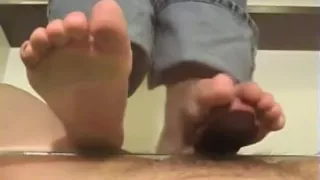 Footjob on the glass with cumshot