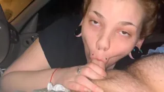 Slutty redhead gives sloppy head in public.