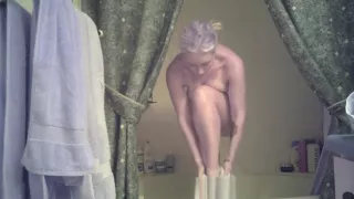 Girl drying off after shower. Lots of titty, pussy and ass.