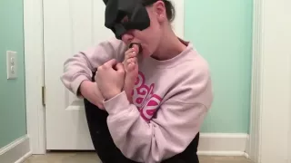 Batgirl Licks Own Feet