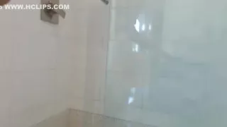 Shaving pussy under the shower