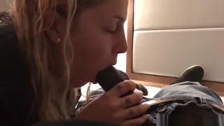 Cute blonde wife taking the black long rod in her mouth