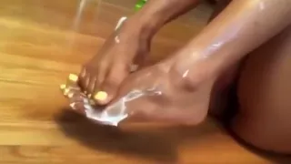 Pretty girl lotioned toes/soles