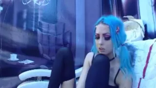 Turquoise haired gothic girl takes off stockings and worships her own feet