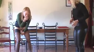 Two girls holding pee competition