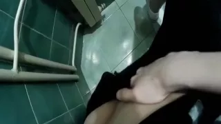Hottie goes to the toilet to finger her tight pussy