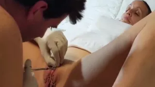 Amateur milf adds a couple new piercings to her shaved pussy